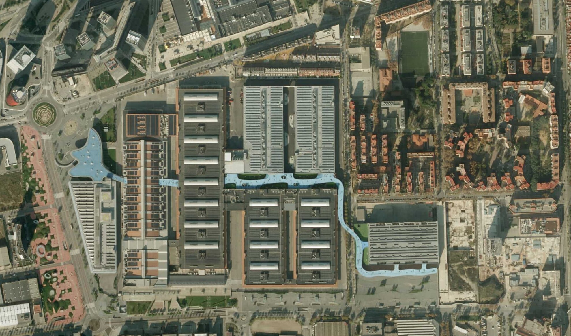 Aerial view of Fira Gran Via in Barcelona, the venue hosting ICE 2026, showing exhibition halls, surrounding streets, and nearby residential areas