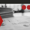 Stack of documents with charts and tables representing prediction market data in 2026