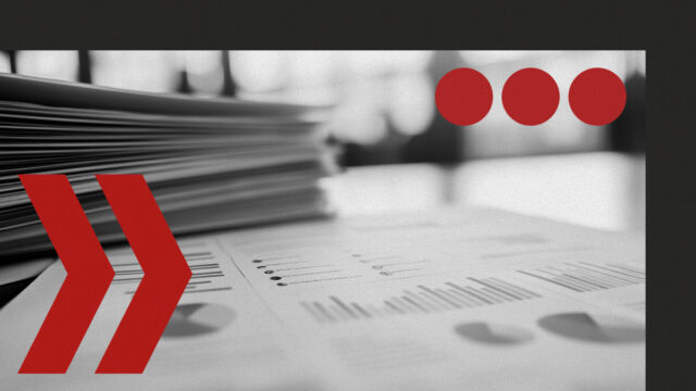 Stack of documents with charts and tables representing prediction market data in 2026