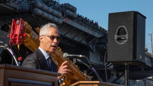 Rahm Emanuel speaking at a podium during a public appearance