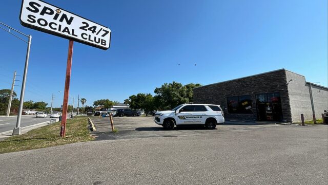 Sarasota County Sheriff vehicle outside Spin 24/7 Social Club during illegal gambling raid