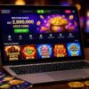 Laptop displaying an online sweepstakes casino platform with slot-style games, gold coins, poker chips, and a mobile casino app on a table.