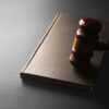 Judge's gavel resting on a legal book