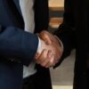 Two business executives shaking hands