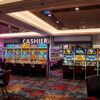 Rows of illuminated slot machines inside the newly expanded first-floor gaming area at Resorts World New York City.