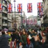 Union Jack flags hanging above a street in London, England.