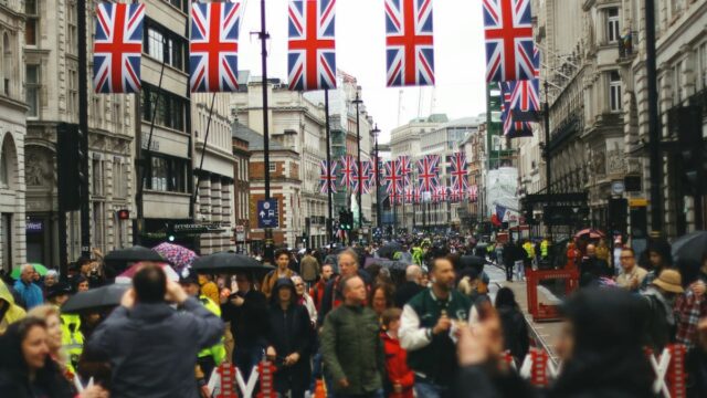 Union Jack flags hanging above a street in London, England.
