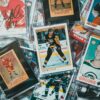 Assorted collectible hockey trading cards displayed in protective plastic cases.