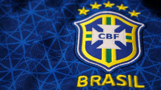 Close-up of a blue Brazil national football team jersey featuring the CBF crest and Brasil lettering.