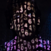 Close up of a man's head and shoulders against a dark background. He is overlaid in electronic numbers.