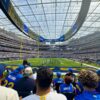 Fans watch an NFL game from behind the end zone at SoFi Stadium in Los Angeles.